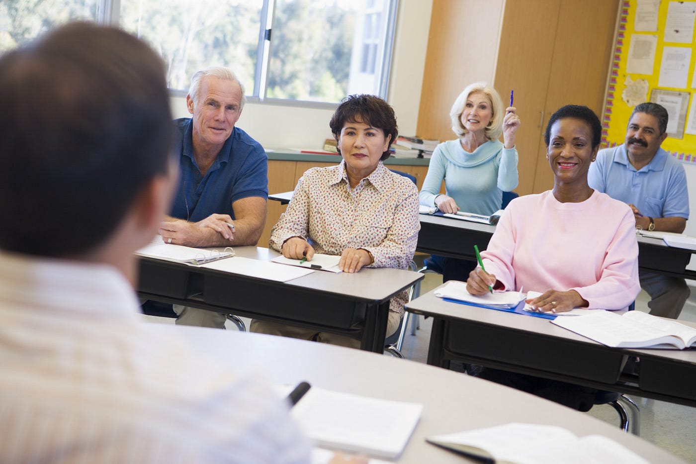 Adult learners taking part in a classroom session